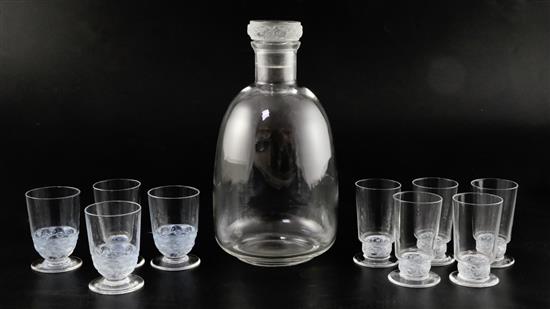 A Rene Lalique Dampierre pattern carafe and six glasses with moulded bands of birds and three Pouilly pattern glasses carafe 22cm